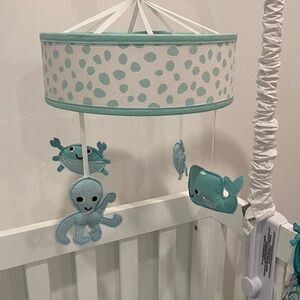 Aqua Polka Dot Baby Mobile and honest blue matress cover